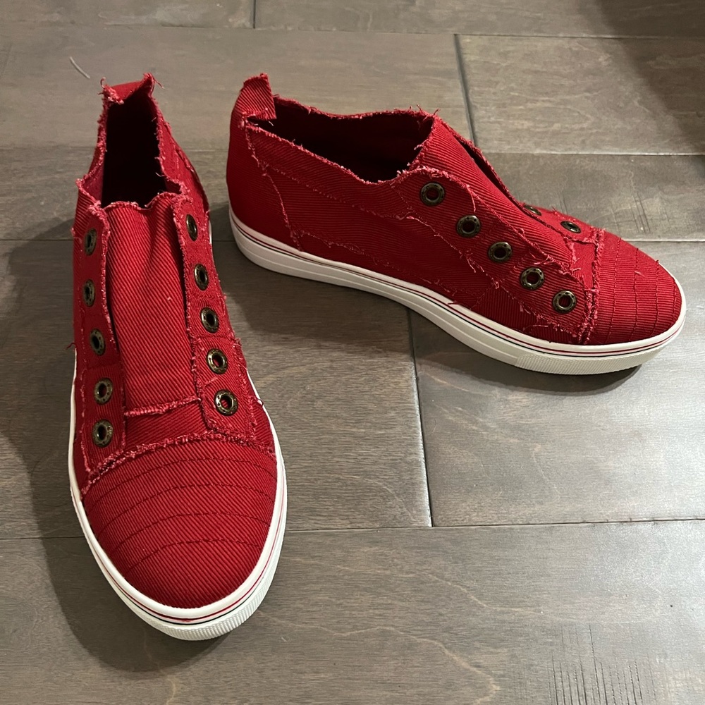 Red slip on tennis shoes